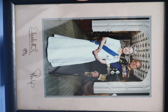 Two signed Royal photographs, The Queen and Prince Philip, Prince Charles and a book House of Windsor portraits